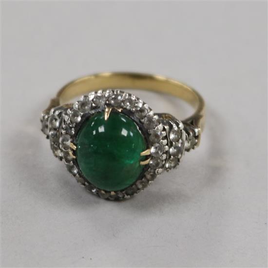 A yellow metal, cabochon emerald and white sapphire? cluster ring, size K.